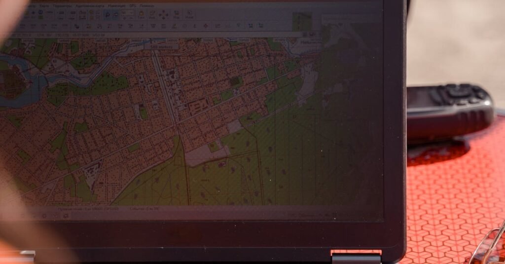 A field surveyor uses a laptop for mapping and navigation outdoors, ensuring accuracy.