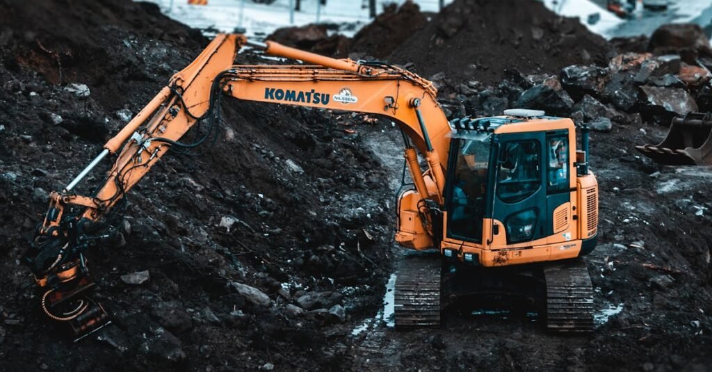 A Komatsu excavator working on a snowy construction site in Tromsø, Norway.